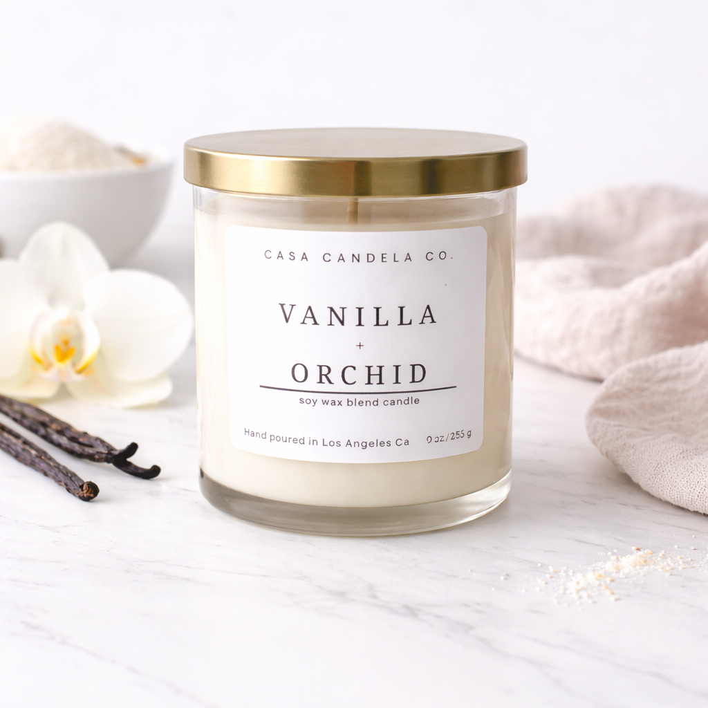 Vanilla and Orchid soy candle in clear glass jar with gold lid - Casa Candela Co